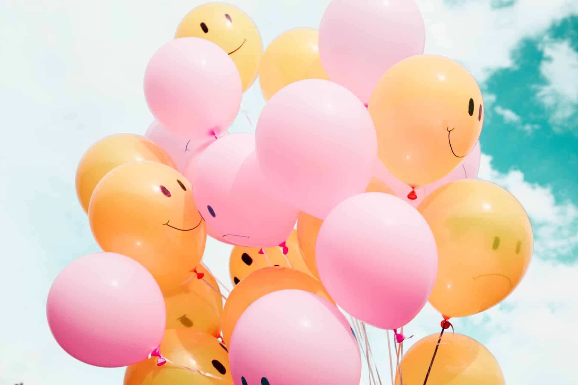Orange and Pink Balloons With Happy Faces | Counseling Services