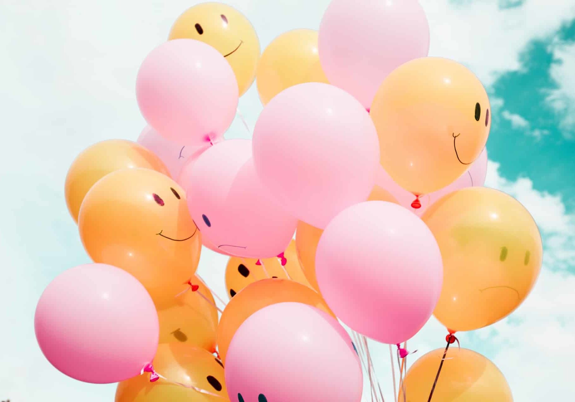 Orange and Pink Balloons With Happy Faces | Counseling Services